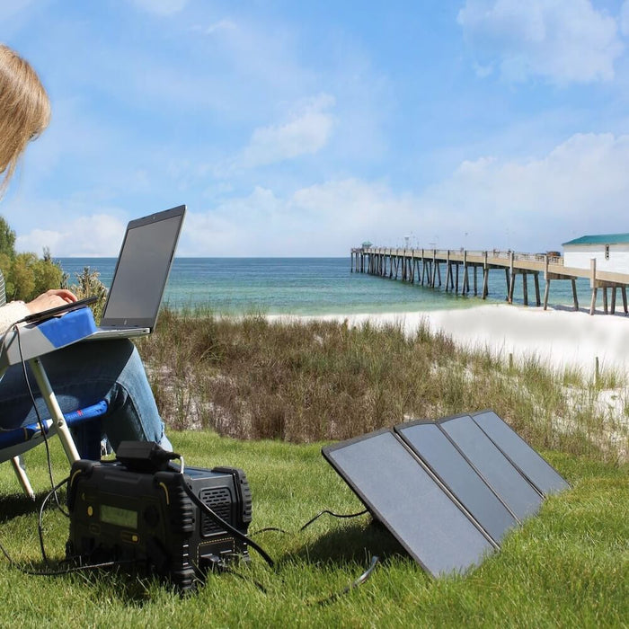 Lion Energy 50W Foldable Solar Panel 50170172 Powering Computer on Beach