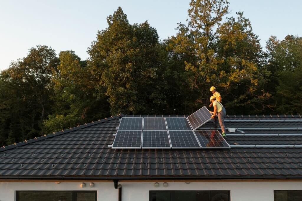 Solar Panel Workers on Roof